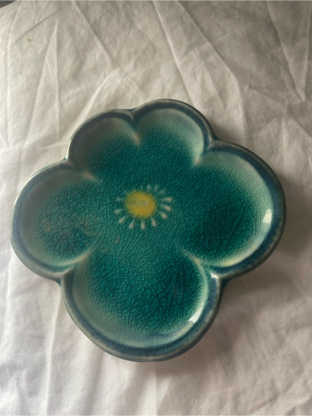 Teal Flower-Shaped Pottery Accent Dish with Yellow Center